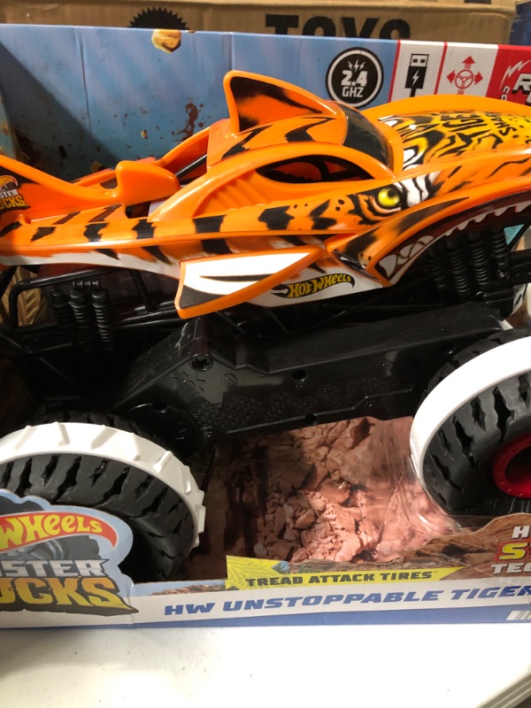 Photo 3 of Hot Wheels Monster Trucks, Remote Control Car, Monster Truck Toy with All-Terrain Wheels, 1:15 Scale Unstoppable Tiger Shark RC