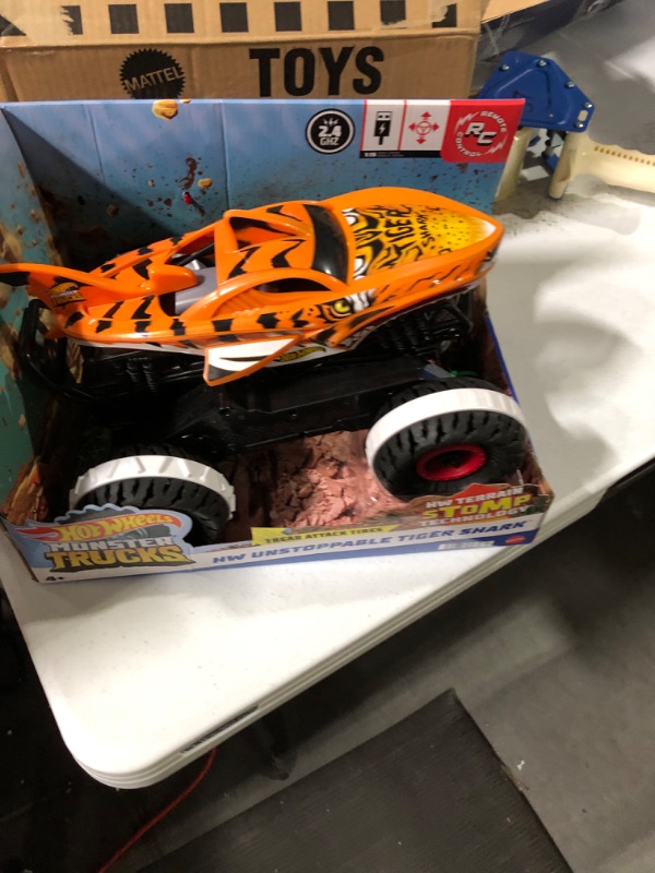 Photo 2 of Hot Wheels Monster Trucks, Remote Control Car, Monster Truck Toy with All-Terrain Wheels, 1:15 Scale Unstoppable Tiger Shark RC