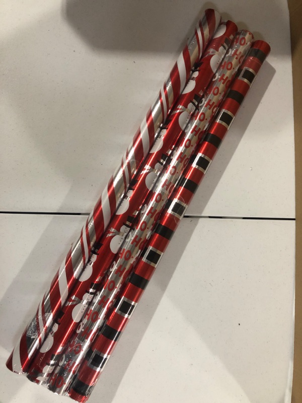 Photo 2 of American Greetings Christmas Foil Reversible Wrapping Paper, Red, Black, and Silver, Candy Cane Stripe, Snowmen, Ho-ho-ho, Santa Belt, 4-Roll, 30 inch