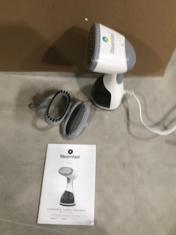 Photo 2 of **SEE NOTES**
Steamfast SF-452 Handheld Garment Steamer 20 Second Heat Up, Long Steam Time, Removable Tank, for Travel, White