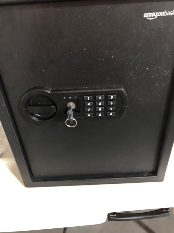 Photo 2 of **SEE NOTES**
Amazon Basics Steel Home Security Safe with Programmable Keypad - Secure Documents, Jewelry, Valuables - 1.8 Cubic Feet, 13.8 x 13 x 19.7 Inches, Black
