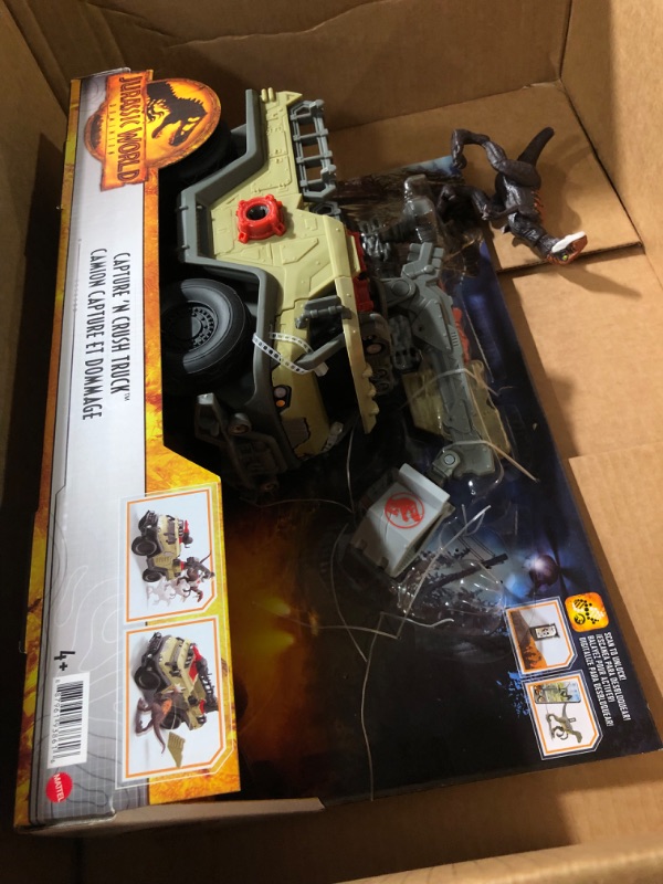 Photo 2 of Jurassic World Dominion Capture and Crush Truck with Velociraptor Dinosaur Figure