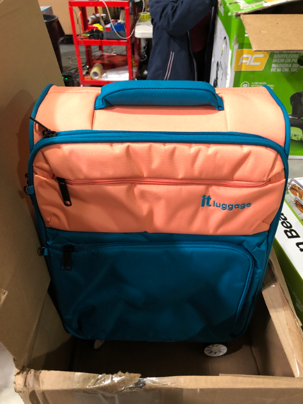 Photo 3 of USED: it luggage Duo-Tone 22" Softside Carry-On 8 Wheel Spinner, Peach/Sea Teal 22" Peach / Sea Teal