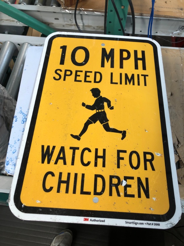 Photo 1 of SmartSign 18 x 12 inch “10 MPH Speed Limit - Watch For Children” Metal Sign, 63 mil Aluminum, 3M Laminated Engineer Grade Reflective Material, Black and Yellow