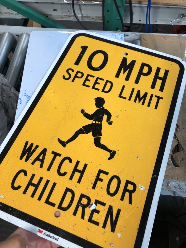 Photo 2 of SmartSign 18 x 12 inch “10 MPH Speed Limit - Watch For Children” Metal Sign, 63 mil Aluminum, 3M Laminated Engineer Grade Reflective Material, Black and Yellow