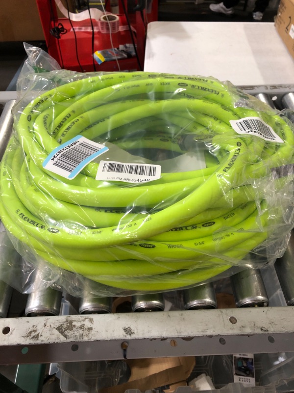 Photo 2 of * USED * 
Flexzilla Garden Hose 5/8 in. x 75 ft, Heavy Duty, Lightweight, Drinking Water Safe, ZillaGreen - HFZG575YW-E & 6-Pattern Adjustable Garden Hose Nozzle - NFZG64 5/8" x 75' (feet)