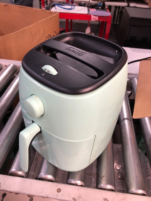 Photo 2 of * USED * 
Dash Tasti Crisp Electric Air Fryer + Oven Cooker with Temperature Control, Non-stick Fry Basket, Recipe Guide + Auto Shut Off Feature, 1000-Watt, 2.6 Quart - Aqua