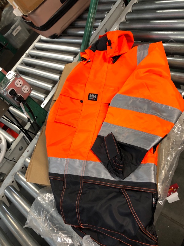 Photo 2 of Helly-Hansen Potsdam Hi Vis Rain Jacket - Waterproof and Windproof Workwear with Detachable Helmet-Sized Hood, ANSI Class 3 XX-Small Orange