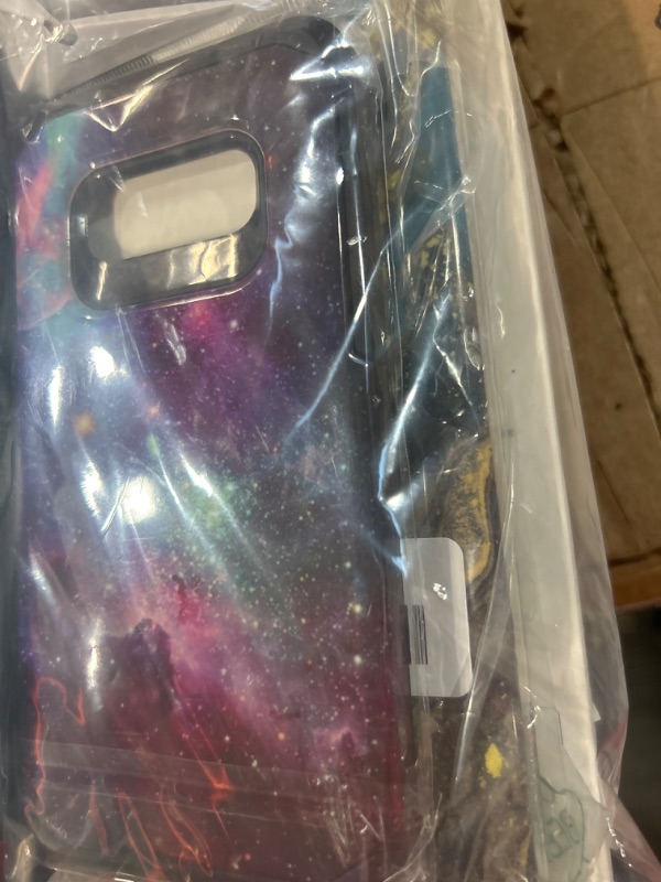 Photo 1 of **MISCELLANEOUS PHONE CASE/EXTRAS BUNDLE**
