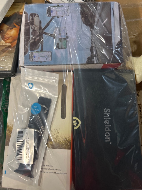 Photo 1 of **MISCELLANEOUS PHONE CASE/EXTRAS BUNDLE**

