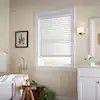 Photo 1 of White Cordless Faux Wood Blinds for Windows with 2 in. Slats - 34.5 in. W x 54 in. L (Actual Size 34 in. W x 54 in. L)