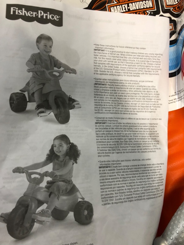 Photo 2 of Fisher-Price Harley-Davidson Tricycle with Handlebar Grips and Storage Area, Multi-Terrain Tires, Tough Trike [Amazon Exclusive]