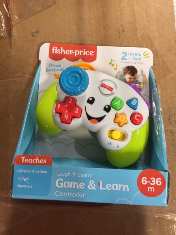 Photo 2 of Fisher-Price Pretend Video Game Controller Baby Toy with Music Lights and Learning Songs, Fine Motor Toy Standard