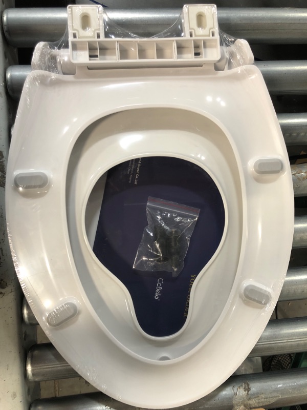 Photo 1 of **PARTS ONLY- BROKEN** Elongated Toilet Seat with Toddler Seat