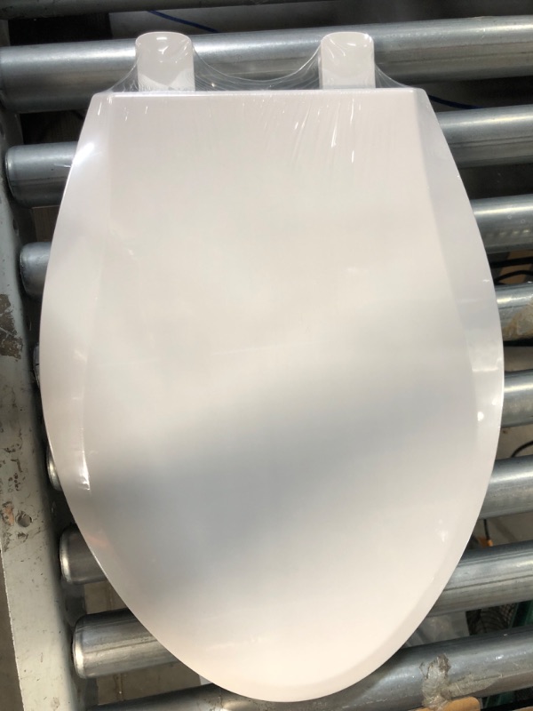 Photo 4 of **PARTS ONLY- BROKEN** Elongated Toilet Seat with Toddler Seat