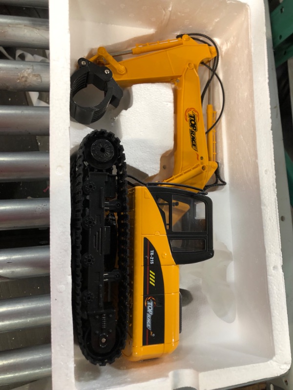 Photo 3 of * item used * missing remote *
Top Race 15 Channel Remote Control Excavator Construction Tractor - Remote Excavator Toy 