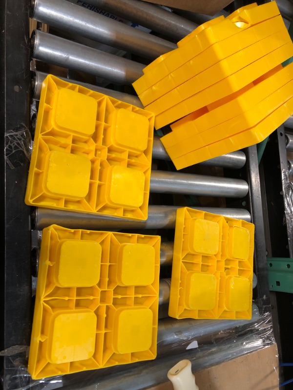 Photo 2 of Camco Fasten 2x2 Leveling Block for Single Tires-Interlocking Design Allows Stacking to Desired Height-Includes Secure T-Handle Carrying System-Yellow-10 Pack (21022)? 8.5 x 8.5 x 1 inches