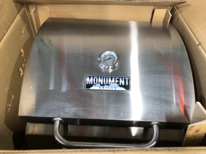 Photo 2 of *SEE NOTES* Monument Grills Tabletop Propane Gas Grill for Outdoor Portable Camping Cooking with Travel Locks, Stainless Steel High Lid, and Built in Thermometer Portable Grill