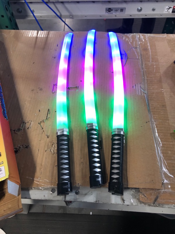 Photo 3 of ArtCreativity Light Up Swords for Kids, Set of 3, 23 Inch Toy Swords with Flashing LED Lights and Sound Effects