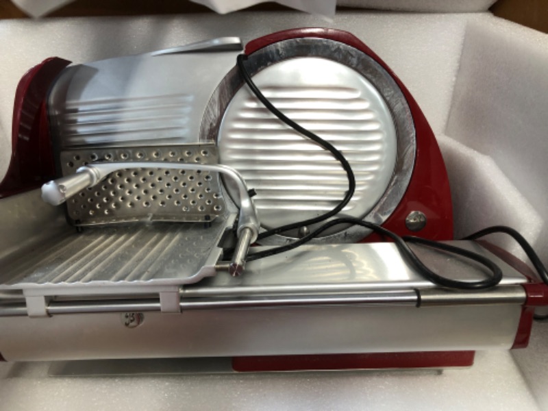 Photo 2 of **FOR PARTS ONLY**
HAS BEEN USED/ VERY DIRTY**
Berkel Home Line 250 Food Slicer/Red/10" Blade/Electric Food Slicer/Slices Prosciutto, Meat, Cold Cuts, Fish, Ham, Cheese, Bread, Fruit and Veggies/Adjustable Thickness Dial/Home-use electic slicer