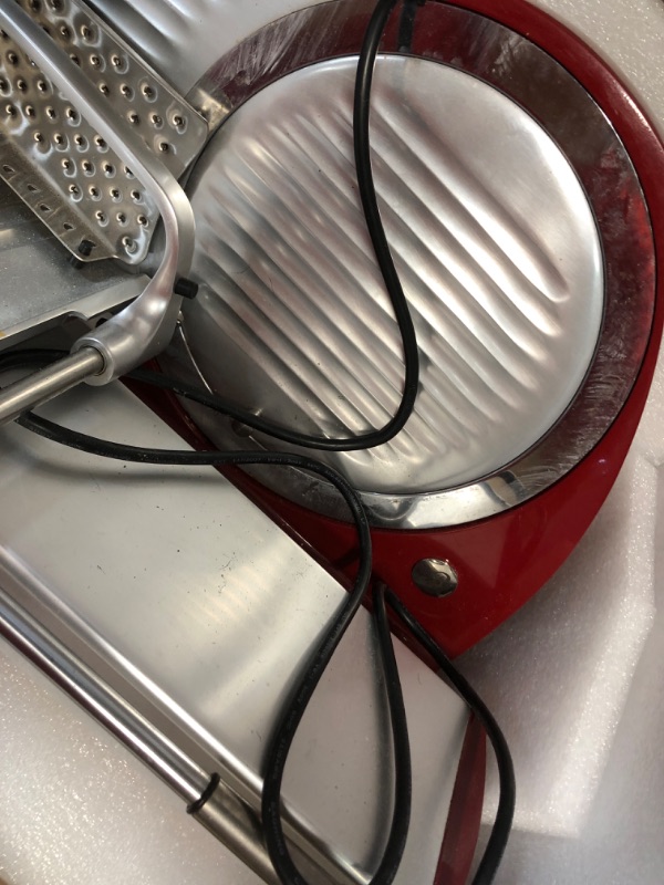 Photo 4 of **FOR PARTS ONLY**
HAS BEEN USED/ VERY DIRTY**
Berkel Home Line 250 Food Slicer/Red/10" Blade/Electric Food Slicer/Slices Prosciutto, Meat, Cold Cuts, Fish, Ham, Cheese, Bread, Fruit and Veggies/Adjustable Thickness Dial/Home-use electic slicer