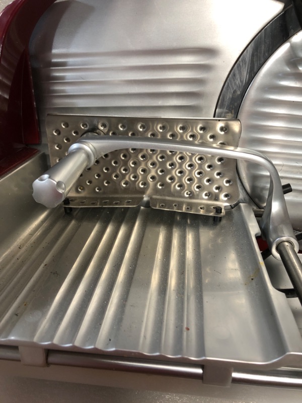Photo 3 of **FOR PARTS ONLY**
HAS BEEN USED/ VERY DIRTY**
Berkel Home Line 250 Food Slicer/Red/10" Blade/Electric Food Slicer/Slices Prosciutto, Meat, Cold Cuts, Fish, Ham, Cheese, Bread, Fruit and Veggies/Adjustable Thickness Dial/Home-use electic slicer