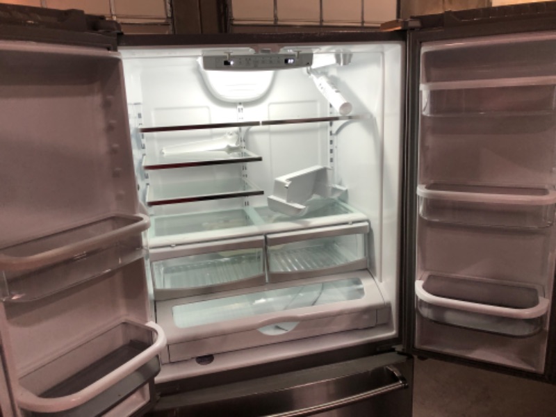 Photo 6 of **HAS A DENT** 20 cu. ft. 36-Inch Width Counter-Depth French Door Refrigerator with Interior Dispense TESTED USED