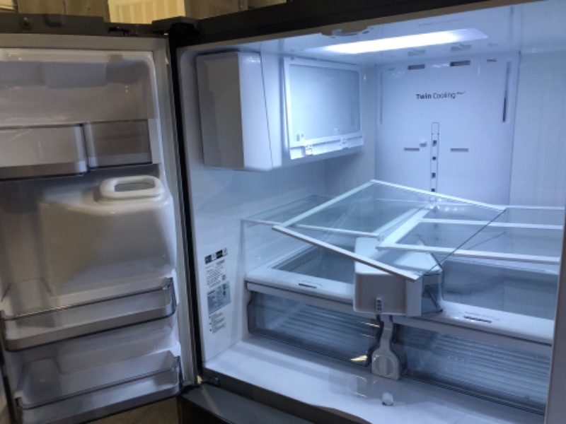 Photo 1 of 27 cu. ft. Large Capacity 3-Door French Door Refrigerator with Dual Ice Maker in Stainless Steel SAMSUNG