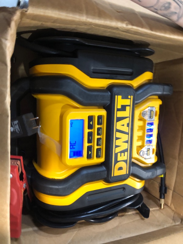 Photo 1 of DEWALT DXAEPS14 1600 Peak Battery Amp 12V Automotive Jump Starter/Power Station with 500 Watt AC Power Inverter, 120 PSI Digital Compressor, and USB Power , Yellow