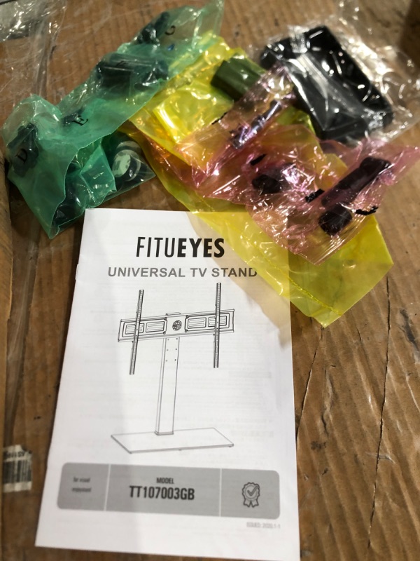Photo 1 of FITUEYES Universal TV Stand/Base Mount for 50 to 85 inch Flat Screen TV 100 Degree Swivel, 4 Level Height Adjustable,Tempered Glass Base,Holds up to 143lbs Screens