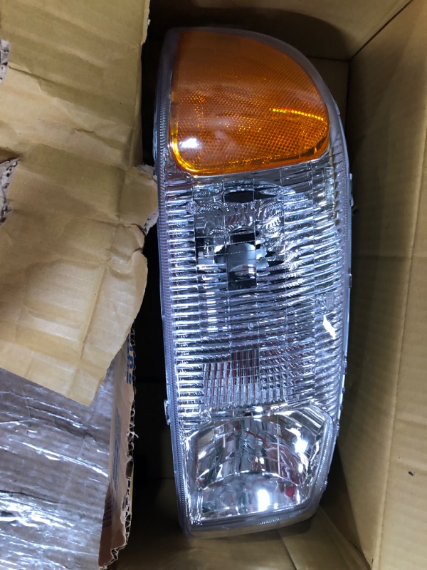 Photo 2 of TYC Left Headlight Assembly Compatible with 1999-2006 GMC Sierra Pickup Driver Side