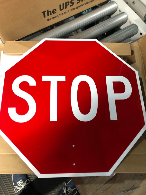 Photo 2 of SmartSign 18 x 18 inch Handheld “STOP - SLOW” Paddle Sign with Handle, Double-Sided, Screen Printed, 120 mil Aluminum Composite, Multicolor 18" Non-Reflective