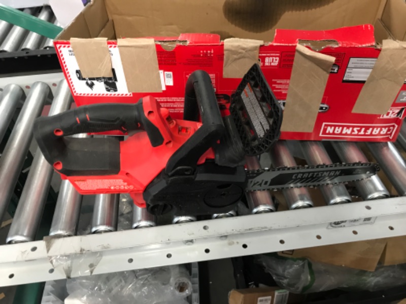 Photo 2 of **MISSING BATTERY**
Craftsman V20* Cordless Chainsaw, 12-Inch (CMCCS620M1) and V20* Lithium Ion Battery, 2.0-Amp Hour (CMCB202)