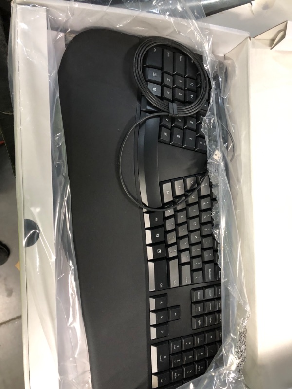 Photo 2 of Microsoft Ergonomic Keyboard - Black. Wired, Comfortable, Ergonomic Keyboard with Cushioned Wrist and Palm Support. Split Keyboard. Dedicated Office Key.