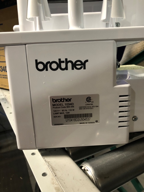 Photo 6 of *USED* Brother Serger, 1034D, Heavy-Duty Metal Frame Overlock Machine, 1,300 Stitches Per Minute, Removeable Trim Trap, 3 Included Accessory Feet,White