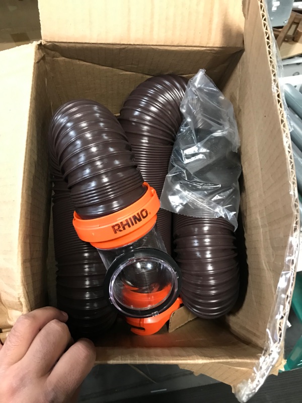 Photo 3 of Camco RhinoFLEX RV Sewer Hose Kit with Swivel Transparent Elbow and 4-in-1 Dump Station Fitting, Brown, 15 Feet (39770) 15ft Sewer Hose Kit Frustration-Free Packaging