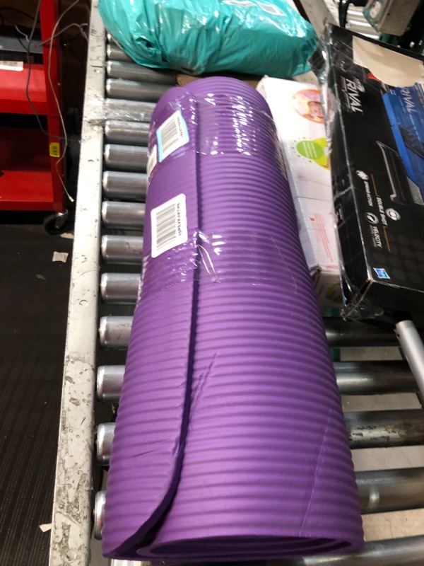 Photo 1 of Amazon Basics Extra Thick Exercise Yoga Gym Floor Mat with Carrying Strap - 74 x 24 x .5 Inches, Purple & High-Density Round Foam Roller for Exercise and Recovery - 36 Inch, Black