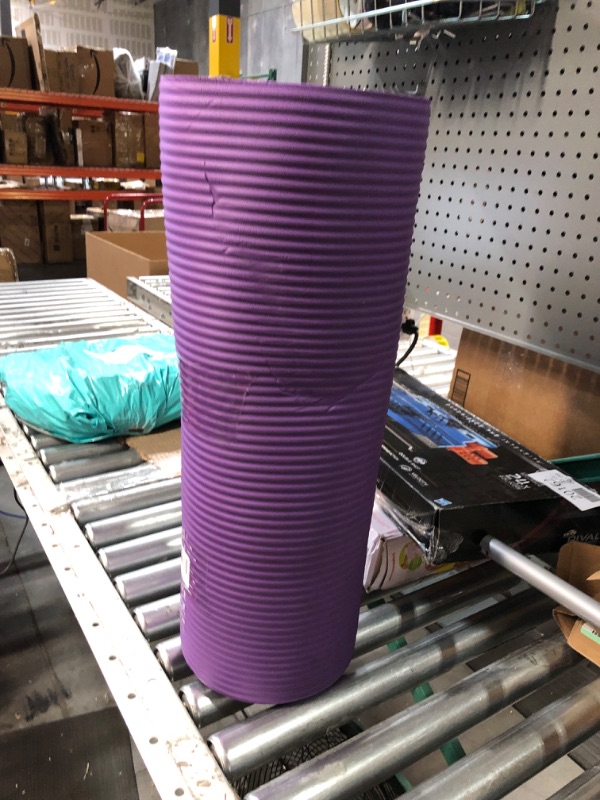 Photo 2 of Amazon Basics Extra Thick Exercise Yoga Gym Floor Mat with Carrying Strap - 74 x 24 x .5 Inches, Purple & High-Density Round Foam Roller for Exercise and Recovery - 36 Inch, Black