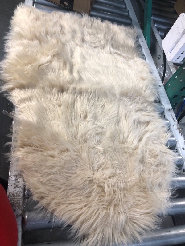 Photo 4 of **A LITTLE DIRTY** SERISSA Faux Sheepskin Fur Area Rug White Fur Chair  2x3 Feet 2 x 3 feet White