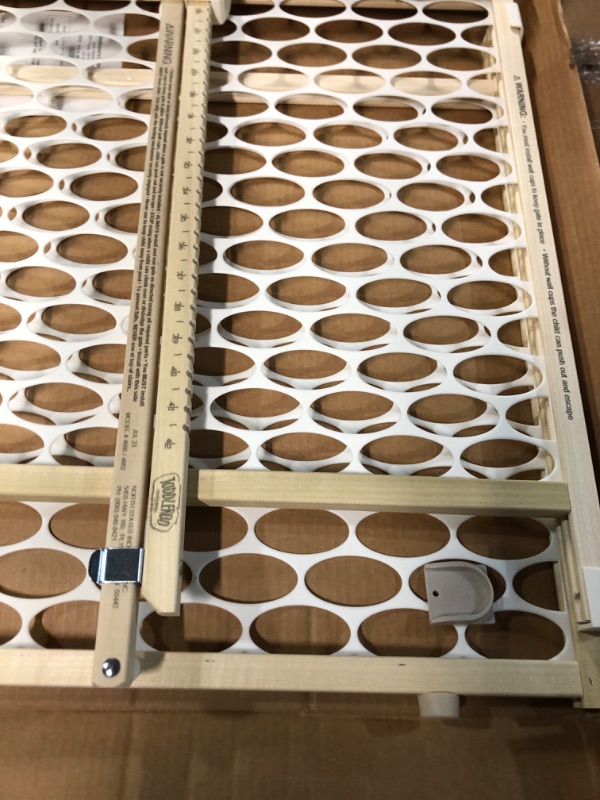 Photo 2 of **USED BUT LOOKS NEW**
Toddleroo by North States 42" wide Quick Fit Oval Mesh Baby Gate, (23"Tall, Sustainable Hardwood & White Oval Mesh) 1-Pack