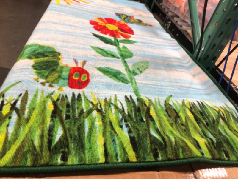 Photo 4 of **USED (DIRTY)**
Eric Carle "The Very Hungry Caterpillar Elementary Sun Scene Kids Machine Washable Area Rug, Blue/Green, 35"x51" Sun Scene 