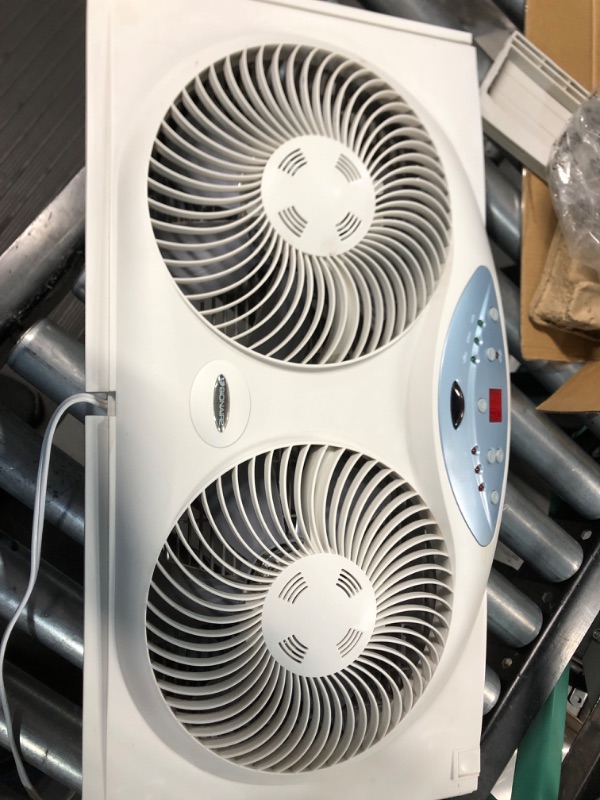 Photo 2 of **HAS BEEN USED- UNABLE TO TEST**
Bionaire Window Fan with Twin 8.5-Inch Reversible Airflow Blades and Remote Control, White 