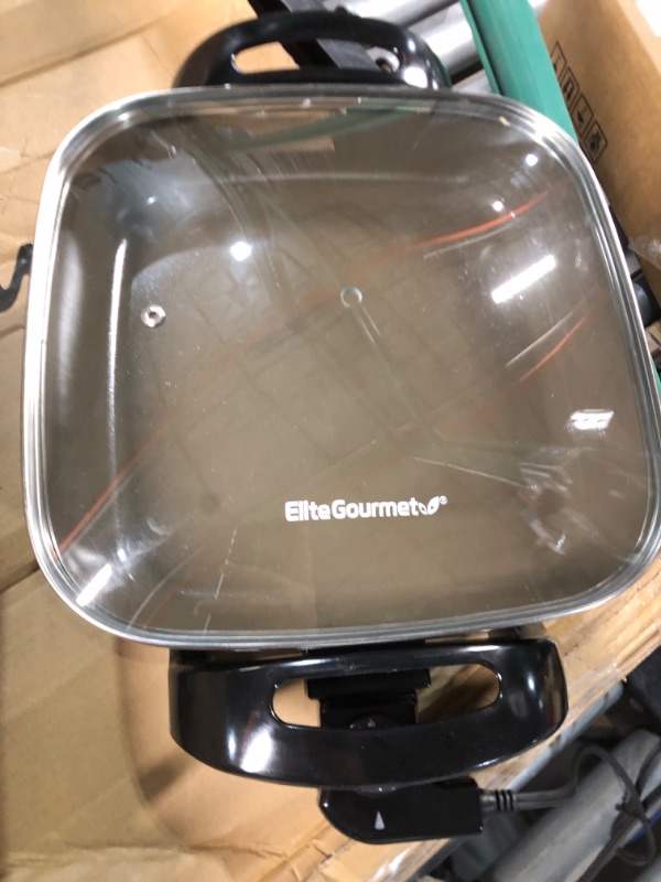 Photo 2 of **LOOKS NEW- TURNS ON- LID HANDLE CAME OFF**
Elite Gourmet EG3033 12"x12"x2.35” Healthy Ceramic with Titanium Coated Scratch Resistant Electric Skillet, Dark Grey, 6 Quart