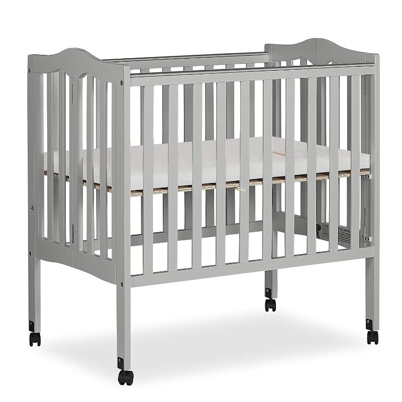 Photo 1 of Dream On Me 2-in-1 Lightweight Folding Portable Stationary Side Crib in Pebble Grey, Greenguard Gold Certified, Baby Crib to Playpen, Folds Flat for Storage, Locking Wheels
