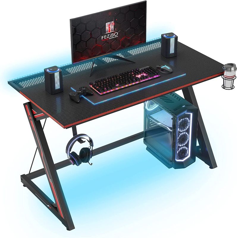 Photo 1 of FEZIBO Gaming Desk 40 inch with LED Lighting, PC Computer Desk Gaming Table Z Shaped Gamer Workstation with Wire Mesh, Black
