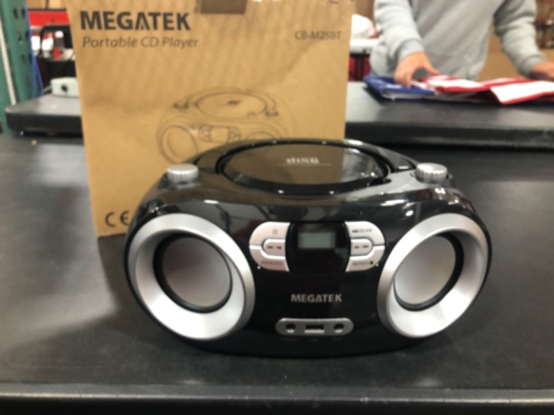 Photo 2 of MEGATEK Portable CD Player/Radio/Bluetooth Boombox with Enhanced Stereo Sound, CD-R/CD-RW/MP3/WMA Playback, USB Port, AUX Input, Headphone Jack, Backlit LCD Display, AC/Battery Operated Black