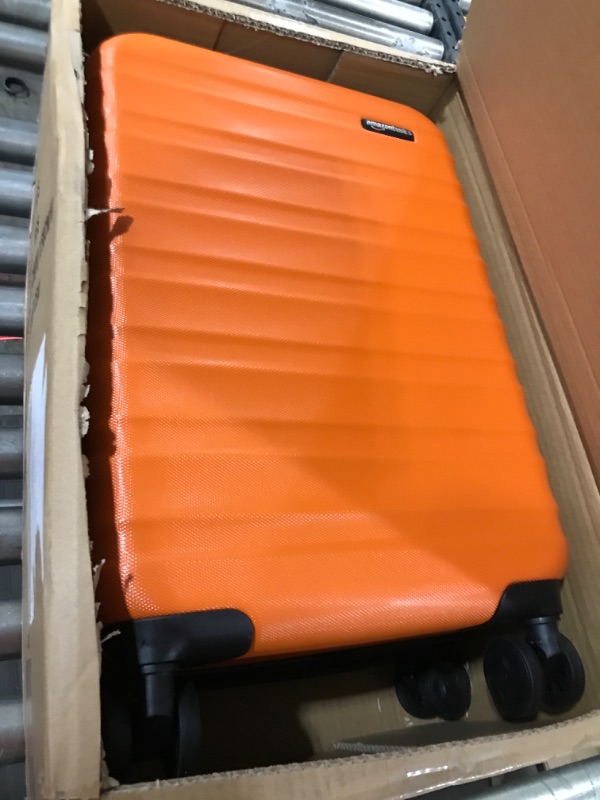 Photo 1 of Amazon Basics 21-Inch Hardside Spinner, Orange Orange 21-inch Spinner