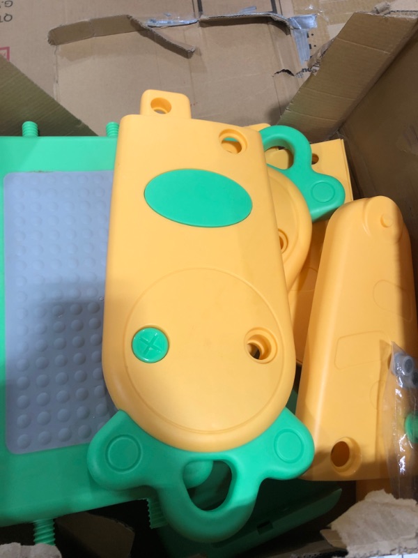 Photo 2 of generic kids green and orange potty training device