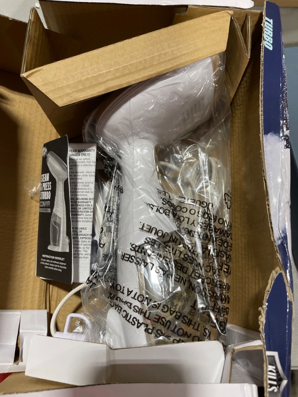 Photo 1 of Conair Handheld Garment Steamer for Clothes, Turbo ExtremeSteam 1875W, Portable Handheld Design, Strong Penetrating Steam Hand Held White / Champagne