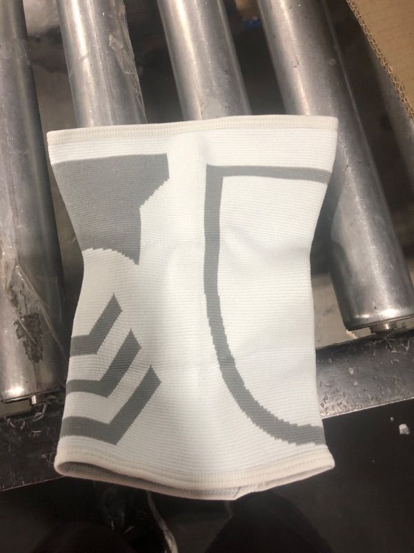 Photo 1 of ACE Brand Compression Knee Support, Provides Support to Weak, Sore Muscles, Flexible, Comfortable, Joint Protection, ACL, Large/Extra Large, White/Gray, 1/Pack Large/X-Large